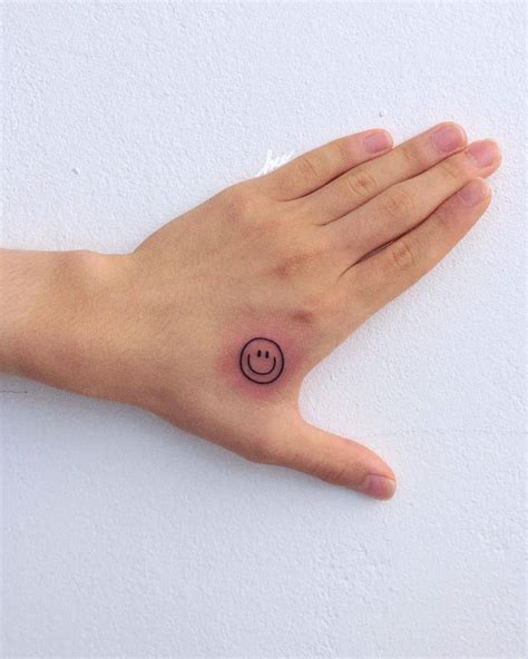 Smiley Face Tattoo On Hand A1paintingnearme