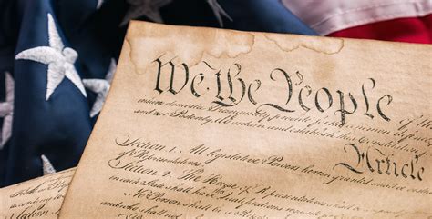 A Stock Photo Of The Us Constitution With The American Flag In The