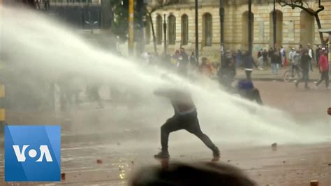 Colombian Police Use Water Cannons Tear Gas Against Protesters Youtube