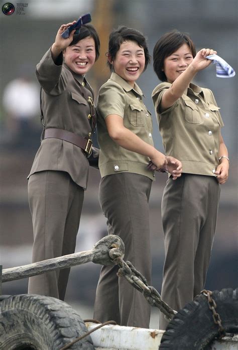 Female North Korean Soldiers Wave To A Chinese Boat For Tourists On The