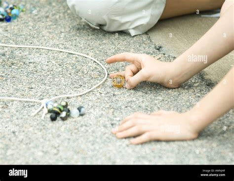 Children Playing Marbles On Asphalt Stock Photo Alamy