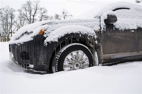 Premium Photo Wheels Of A Dirty Black Car In Deep Snow Tires Are