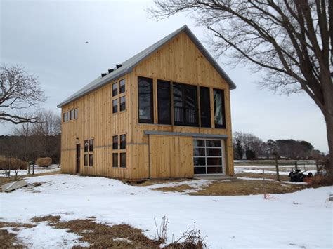 There is a perception that a high top van will not fit in standard garage because of it's height. Garage with Studio. High wind rated windows, fire house-esk garage door facing the river. Wood ...