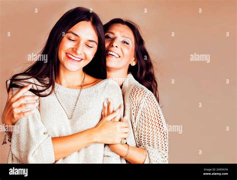Cute Pretty Teen Daughter With Mature Mother Hugging Fashion Style Brunette Makeup Close Up