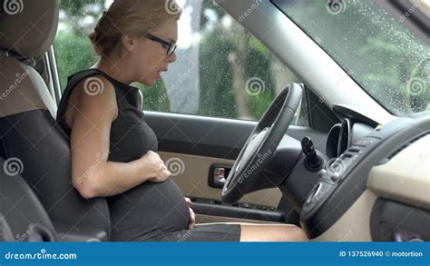 pregnant woman in car hardly breathing preterm birth risk of misbirth health royalty free