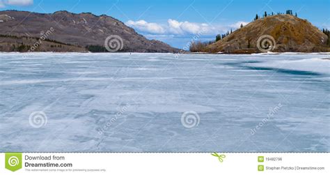 Skiing On Frozen Lake Laberge Yukon Canada Stock Photo