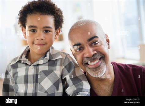 Mixed Race Grandfather And Grandson Smiling Stock Photo Alamy