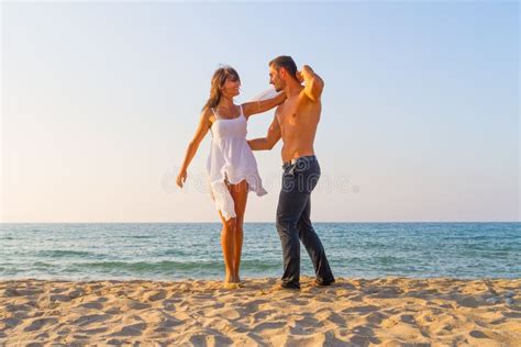Oung Couple Teasing One Another At The Beach Stock Image Image Of Relationship Beach 36014363