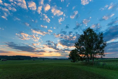 Free Green Meadow Landscape At Sunset Stock Photo