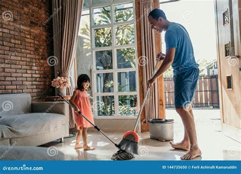 Father And Daughter Clean Up The House Stock Photo Image Of Lifestyle