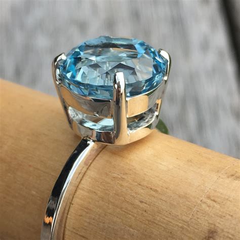 Light Blue Topaz Ring 12mm Stone On A Square Section Ring Band James