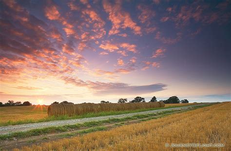 Hay Bales And Country Road At Sunset In Nebraska Photograph Scenic