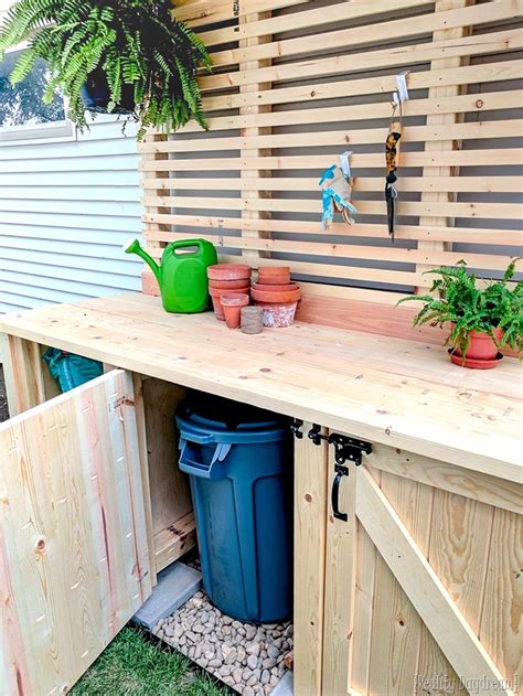 Your trash won't be an eyesore any more. Potting Bench with Hidden Garbage Can Enclosure - Reality ...