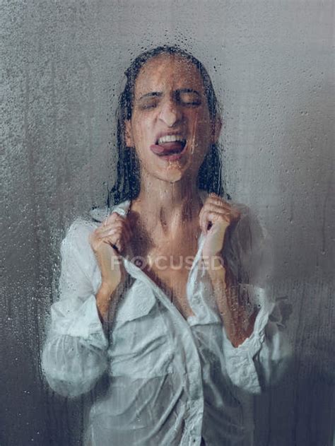 Sopping Woman In Shirt Posing In Shower Cabin With Tongue Out Clean
