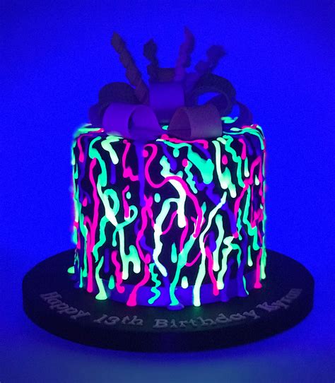 A Fluorescent Glow In The Dark Graffiti Style Drip Cake On Black