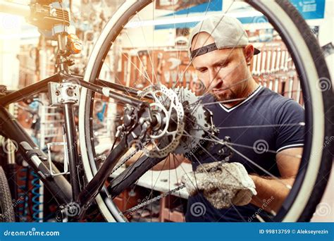 Bicycle Mechanic In A Workshop In The Repair Process Stock Image