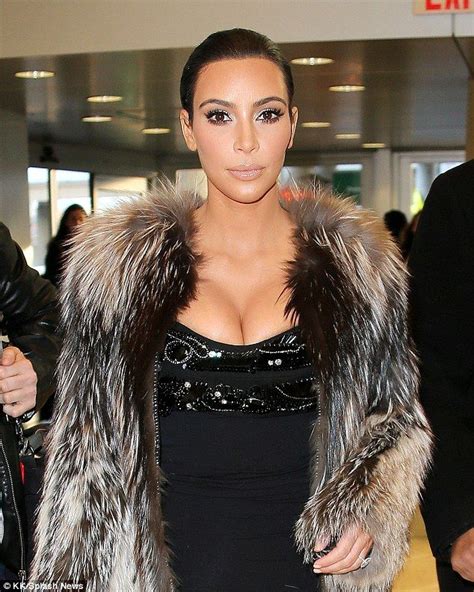 Kim Kardashian Reveals Curves In Dress As She Strips Off Fur Coat