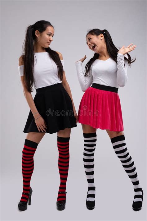 Mischievous Young Fashion Model Teasing Her Friend Stock Image Image