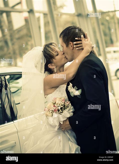 Bride Kissing Groom Stock Photo Alamy