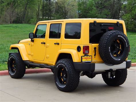 2015 Jeep Wrangler Unlimited Sahara In Baja Yellow Equipped With A