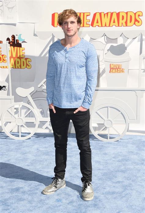 Logan Paul Keeps His Style Casual In A Light Blue Henley
