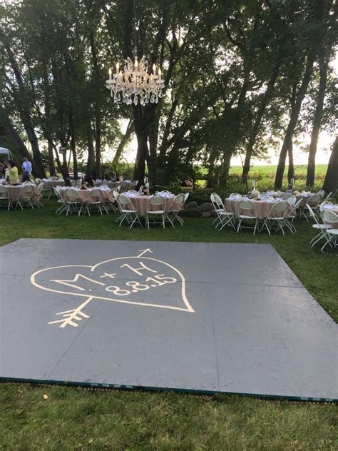 The couple's backyard was transformed into an elegant wedding venue. build a dance floor outside, suspended chandelier in the ...