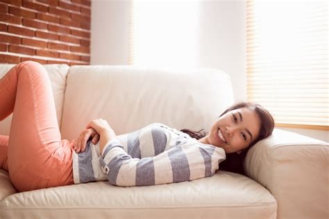 Premium Photo Asian Woman Relaxing On Couch