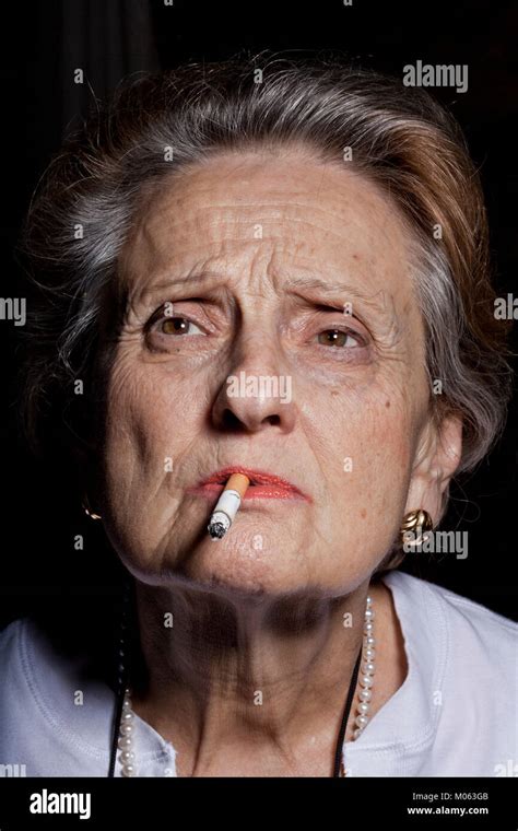 Elderly Woman Smoking Stock Photo Alamy