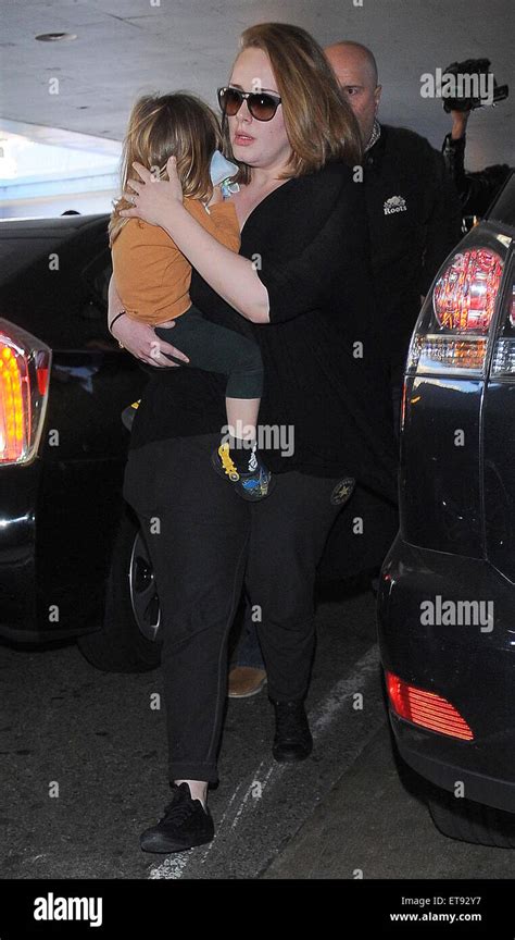 Adele Arrives At Los Angeles International Lax Airport Carrying Her Son Angelo Featuring