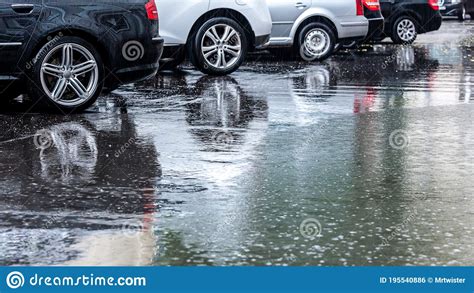 Rainy Day On Streets Parked Cars Under Heavy Rain With Refl Stock