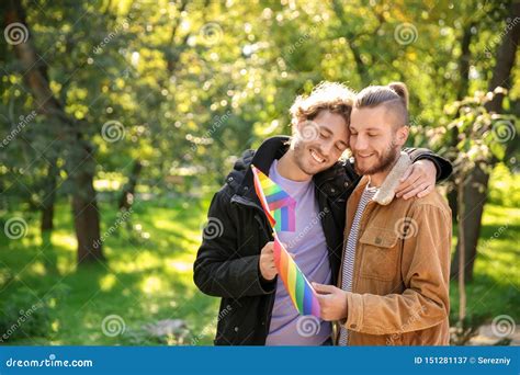 Gay Couple With Rainbow Wristbands And Hand Heart Stock Image 117323605