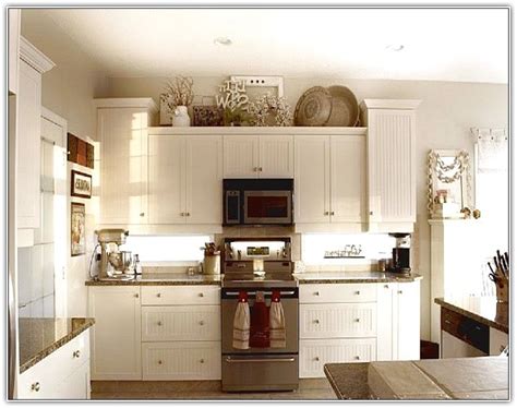 You want to make sure, though, that the objects are large enough to see once up high; Decorate Top Kitchen Cabinets | Home Design Ideas ...