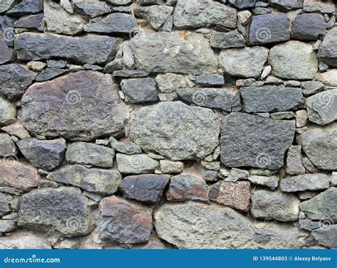 Stone Masonry Wall From Old Dilapidated Shabby Rubble From Big
