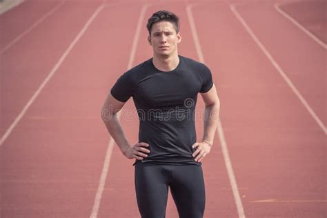 One Young Man Runner Fitness Athlete Posing Running Tracks Stock