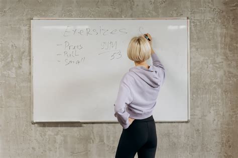 Woman Writing On Whiteboard · Free Stock Photo