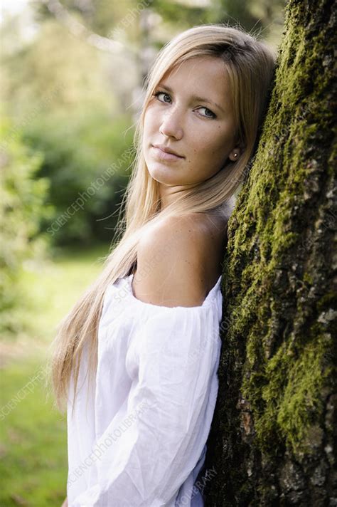 Woman Leaning Against Tree Outdoors Stock Image F Science