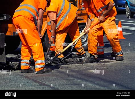 Construction Workers Are Working At The Road Construction Stock Photo