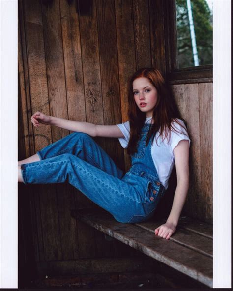 ellie bamber in overalls on wood bench photo print 8 x 10 posterazzi