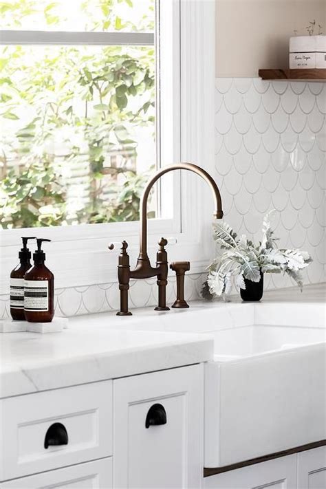 Black bronze farmhouse sink faucet. Gia Renovations | Black kitchen taps, White fish scale tile, Fish scale tile