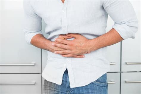 Mid Section Of Man Suffering From Stomach Pain Stock Image Image Of