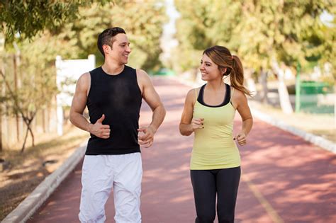 Couple Running Together Outdoors Stock Photo Download Image Now Istock