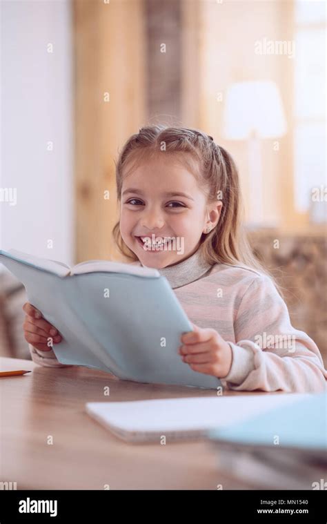 Happy Positive Girl Reading A Book Stock Photo Alamy