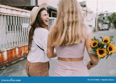 Two Lesbians Walking Down The Street Holding Hands Stock Photo Image