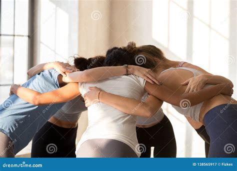 Sportive Girl Embrace Having Motivational Talk at Training Stock Image