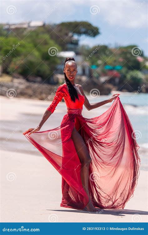 Woman Wearing Red Bikini And Dress On A Tropical Beach Remote Tropical Beach In Barbados