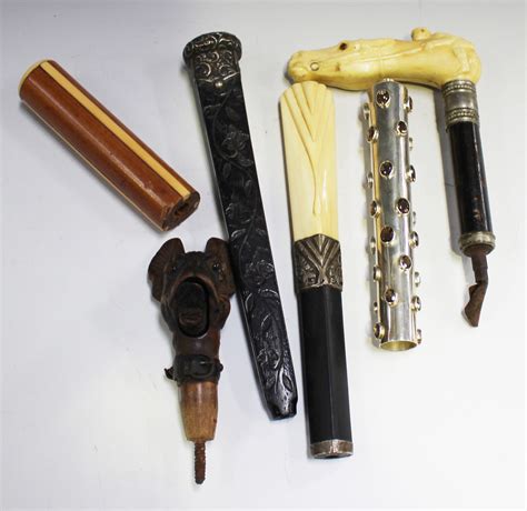 A Group Of Six Walking Cane Handles Including A Carved Softwood
