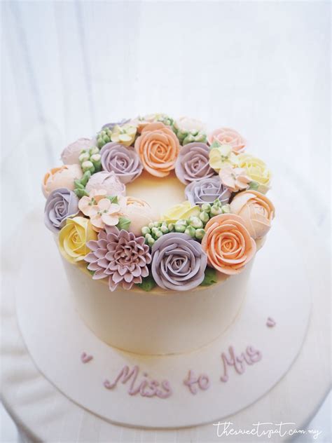 It would resemble the theme of this cake. Mix pastel buttercream flower cake | Buttercream flowers ...
