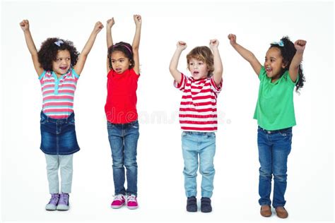 Four Kids Standing Arms Raised Air Stock Photos Free And Royalty Free