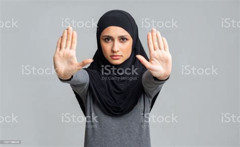 Concerned Muslim Girl Showing Stop Sign Gesture With Two Hands Stock