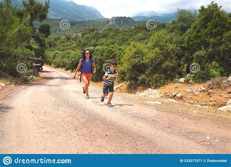 Boy Runs Away From Mom A Woman Travels With A Child Stock Image